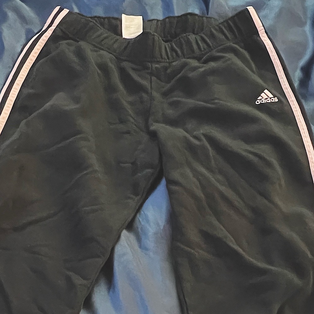 woman’s Adidas track pants